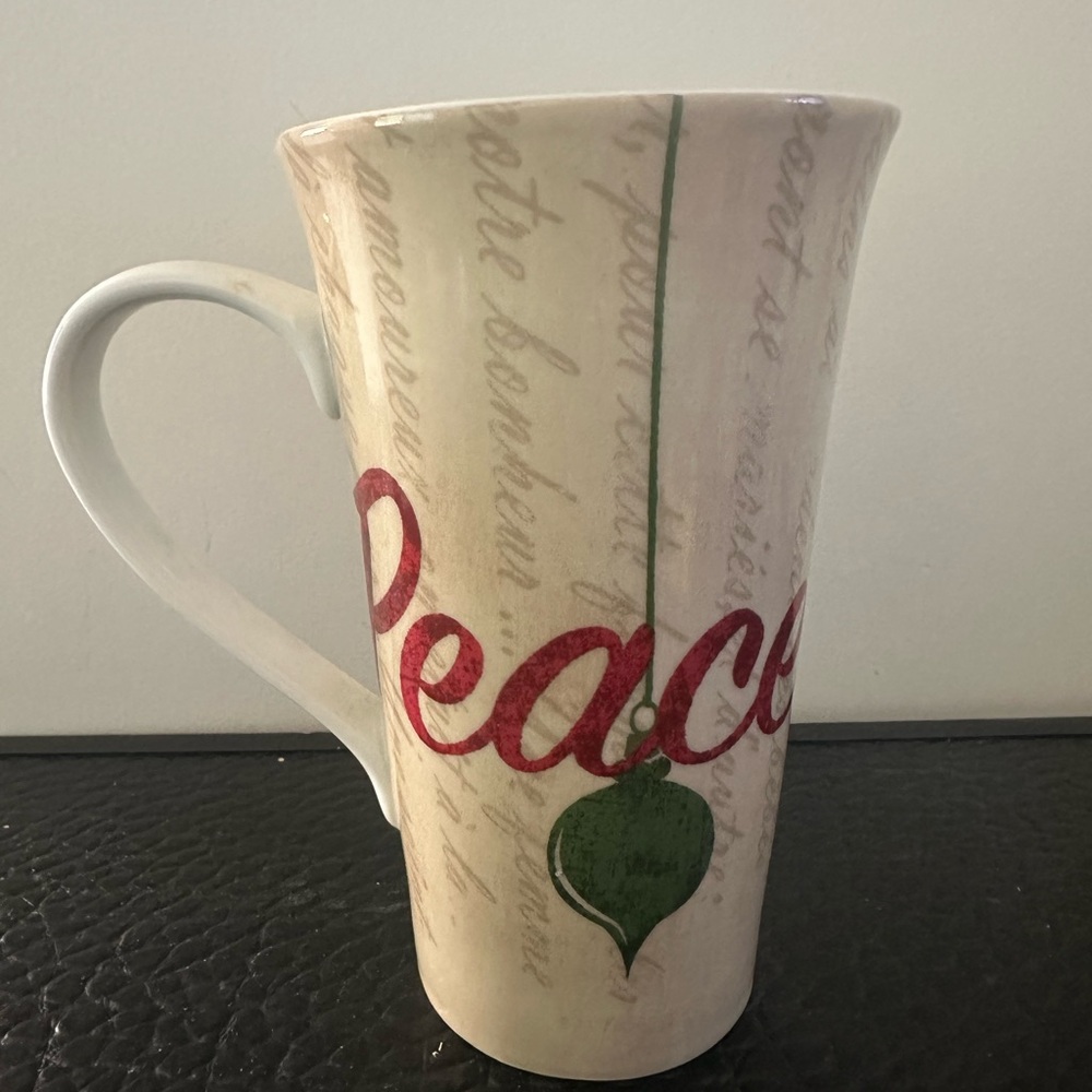 222 Fifth Ceramic Mug beige with script text large, red "Peace"